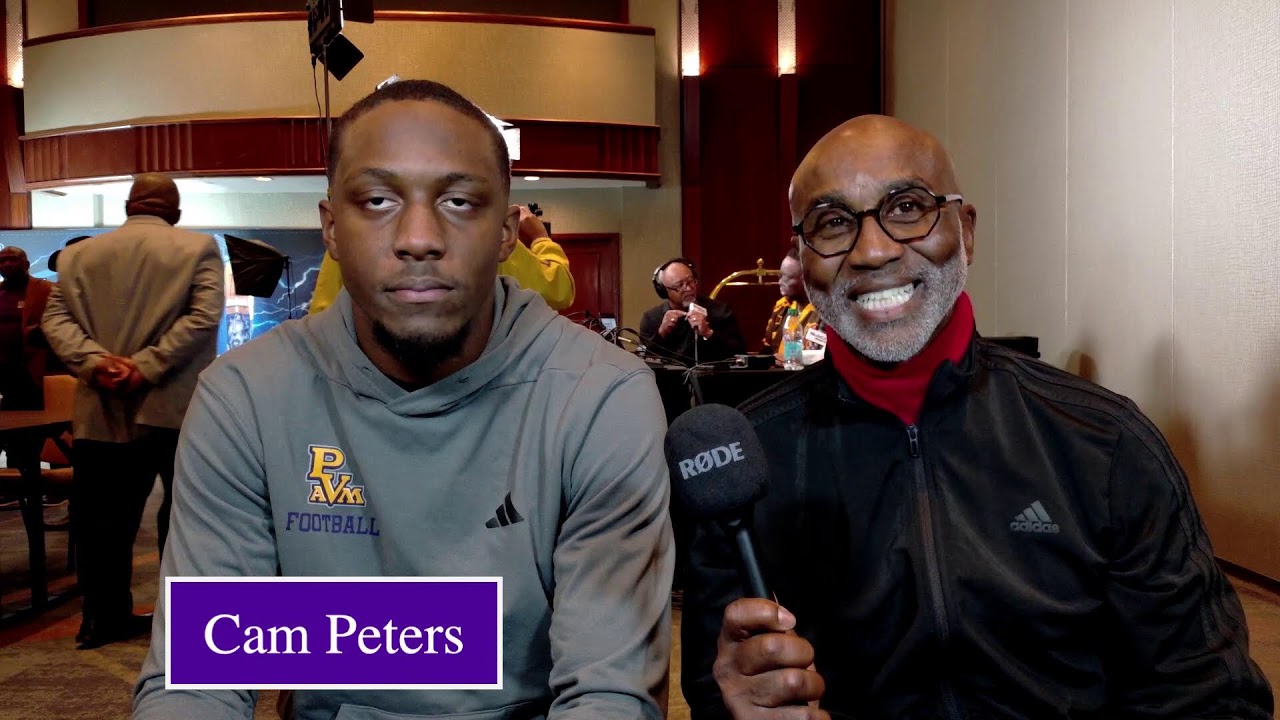 Coach Cole with Cam Peters on Media Row