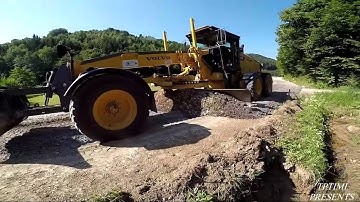 Motor Grader Grading On a Long Road Ground Asphalt -Skilled Operator