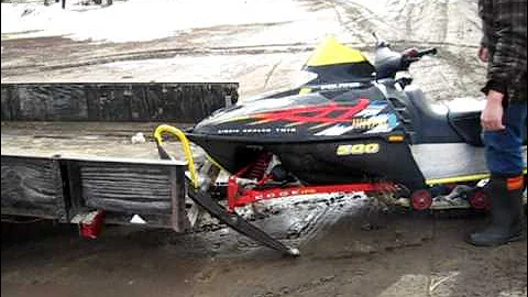 Loading a snowmobile onto a trailer