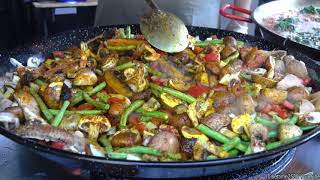 Cooking Spanish Paella with Vegetables and Mushrooms. London Street Food