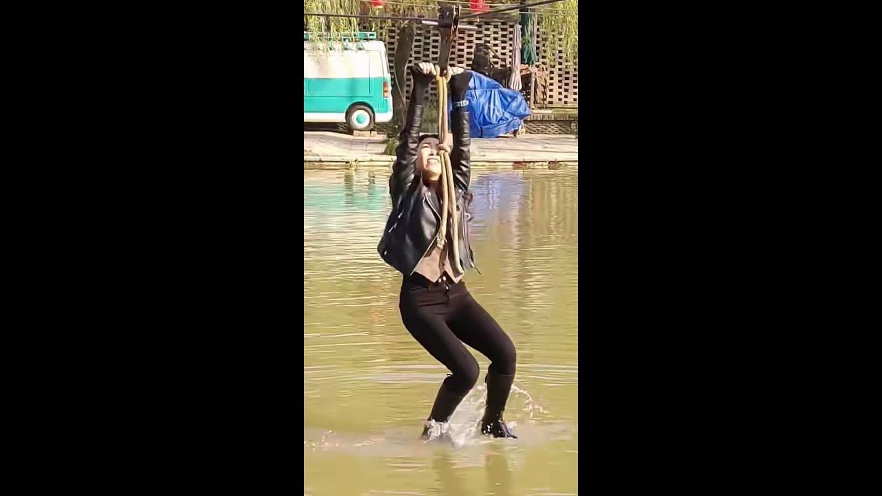 Sexy wet high boots and fall into water
