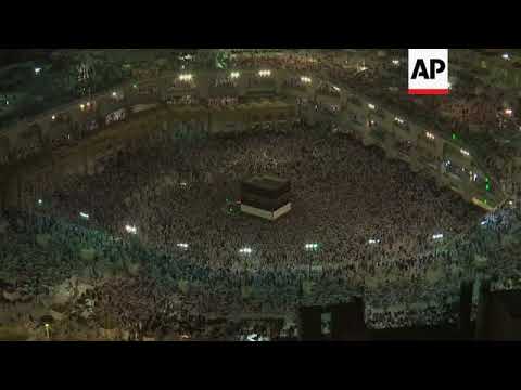 Thousands of Hajj pilgrims circle cube shaped Kaaba in Mecca