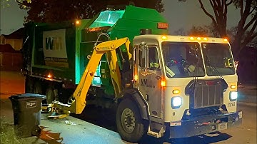 Brand New Massive Waste Management WM Pete 520 Heil Python Side Loader Garbage Truck at Night