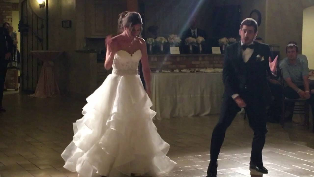 Bride and her brother do epic Evolution of Dance style dance to kick off the reception