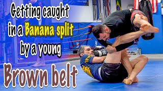 Getting caught in a Banana split submission by a brown belt