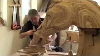 Anthony Dew carving the head of a huge Rocking Horse.