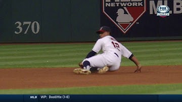 KC@CLE: Lindor makes a run-saving sliding stop