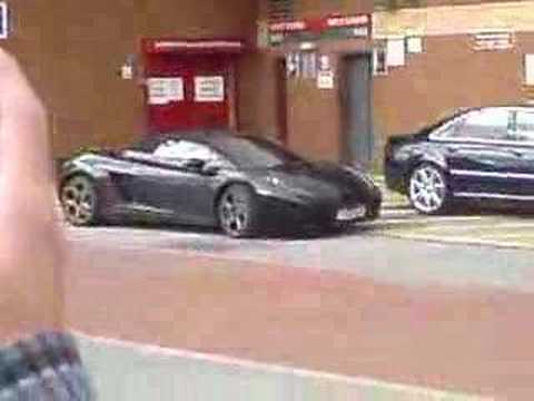 Rooney and Brown arriving at Old trafford to play Inter Milan. Brown is in an Audi, and Rooney in a nice lambo!