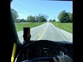 POV Inside of a fully loaded Big Rig Semi Truck 18 Wheeler racing down an old country road. (4)