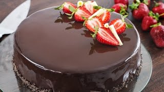 Strawberry and chocolate mirror cake, made with a soft dark cake at
the bottom, followed by white mousse, jelly insert and...