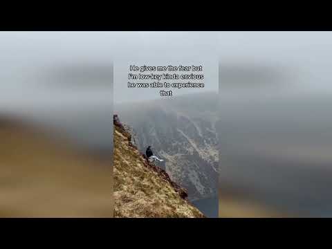 Dramatic video shows daredevil perched on top of protruding rock overlooking Scottish loch