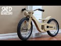 Balance bike with basic tools and scrap plywood