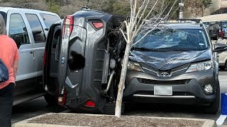 Car gets wedged in H-E-B parking lot in Houston area