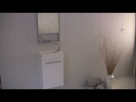 small-white-bath-vanity-by-frescabath-with-mirror-and-single-sink