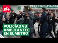 Policías y vendedores ambulantes protagonizan riña en Metro Chabacano - N+