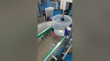 Conical bottle labeling machine