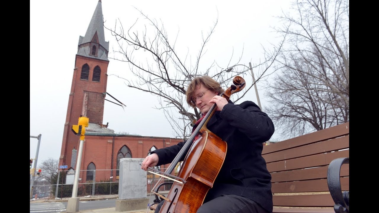 Amherst cellist Ignacy Gaydamovich plays Bach Sarabande Suite No. 1 as Mater Dolorosa falls