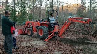 how much is this Rock worth? & friends stop by and test the backhoe.