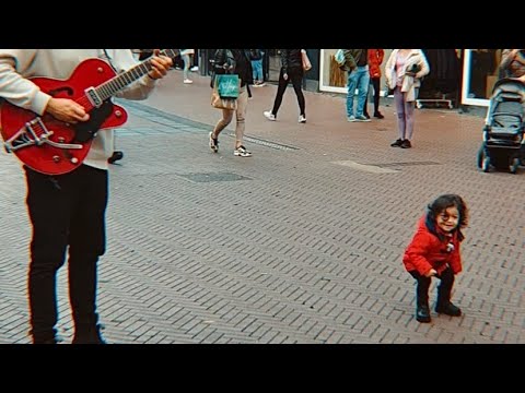 Cute Little Girl dancing with Street Performer