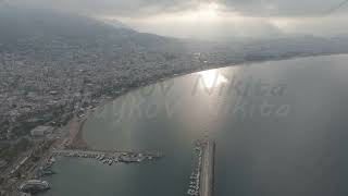 D-Log M. Alanya, Turkey. Aerial shot of Alanya Lighthouse overlooking Antalya Bay and city beache...
