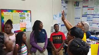 Students encouraging school treasurer