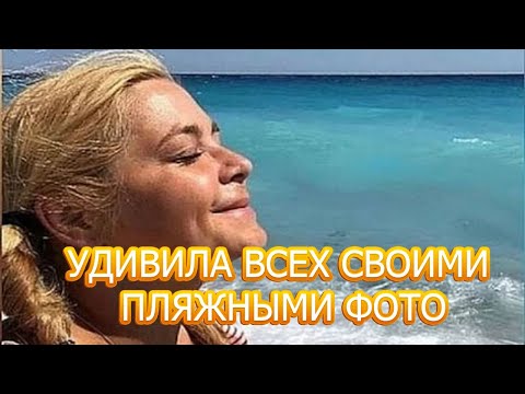 Видео: Ирина Пегова нимбэгний хүрэмтэй, уугуул Выкса дахь цасан бүрхүүлтэй ой дундуур алхав