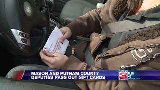Putnam and Mason County deputies pass out gift cards for the holidays