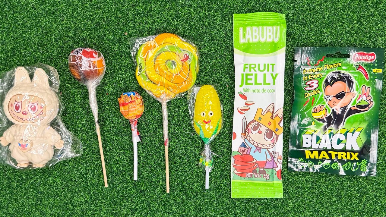 ASMR chocolate and candy unboxing on green grass