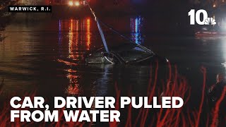 Driver taken to hospital after vehicle falls into water in Warwick