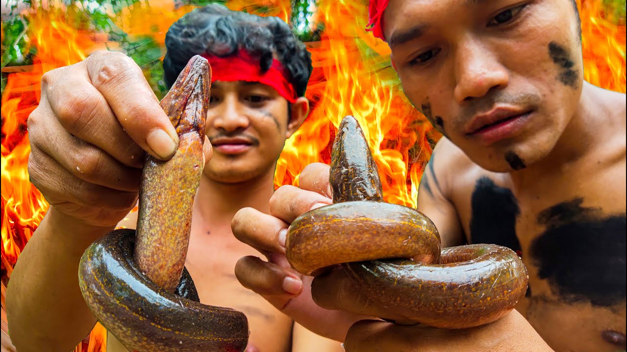 Two wild men cooking - fried hot Eels with special recipe - cooking skill