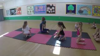 Gymnastics and acrobatics chest roll and chest balance