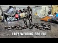 Welded chain bottle holder