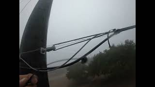 Lashing fiber optics by hand.