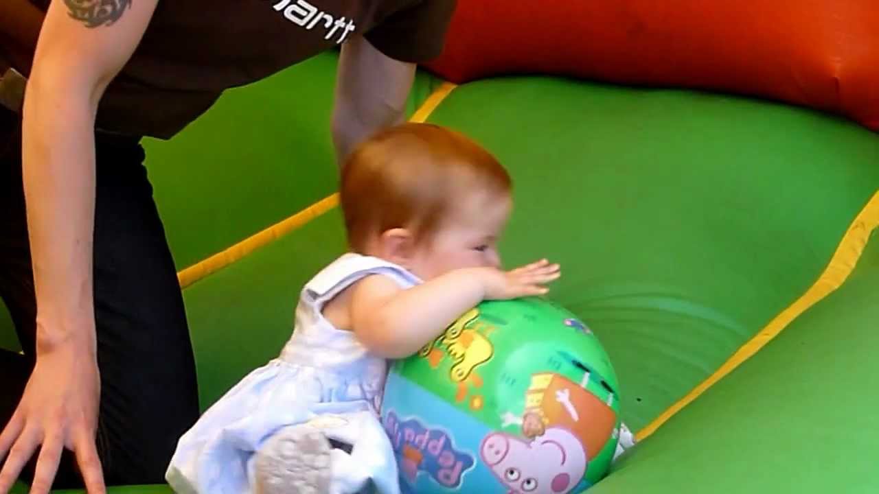 Emily & Daddy on the bouncy castle