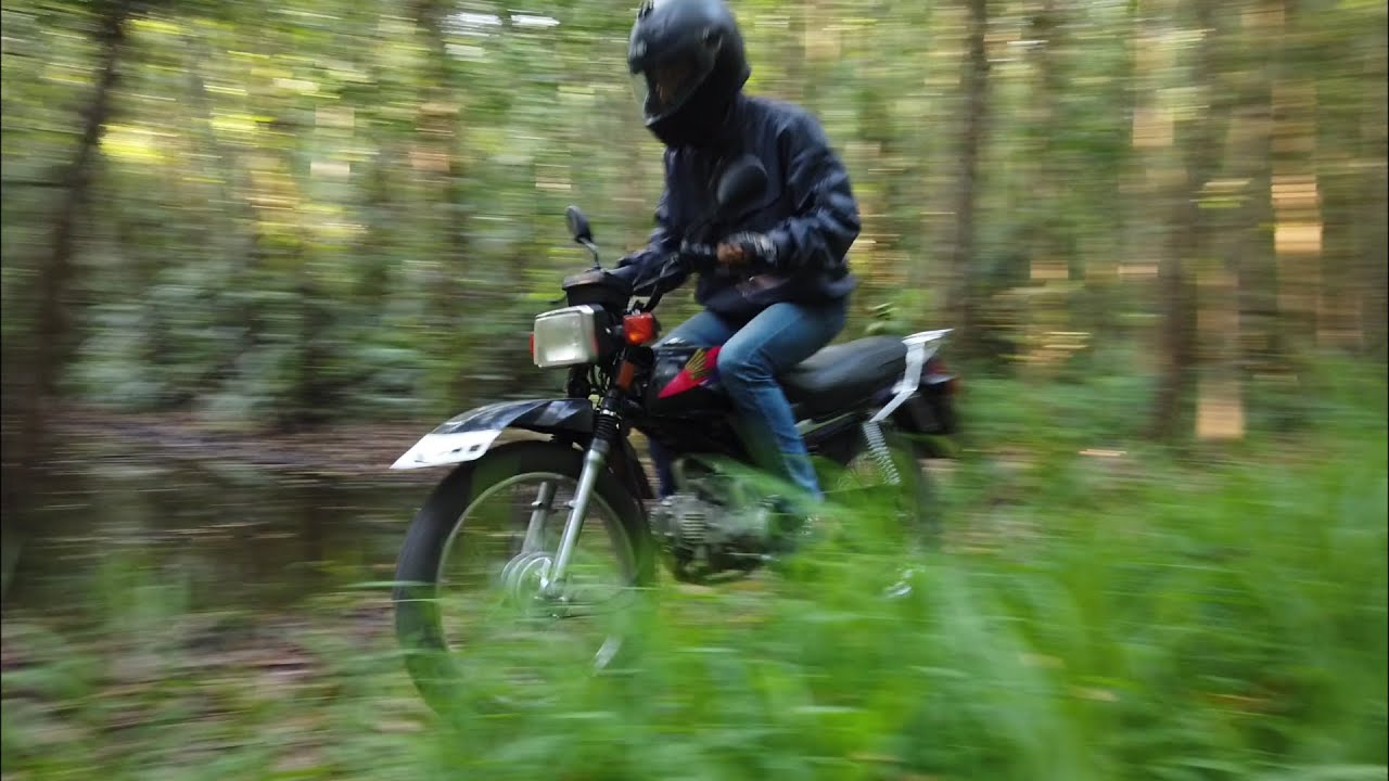 Run offroad alone in the forest, community isolation during Corona disease (COVID-19). Honda Win 100