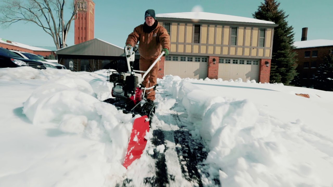 A Walk-Behind Snow Pusher
