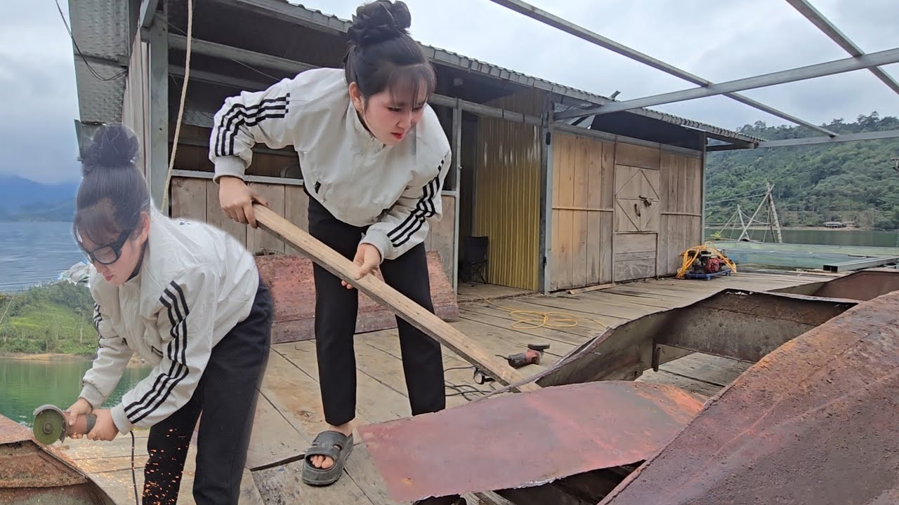 The girl cuts off the entire bottom of the boat and splits the boat in half to replace the entire 