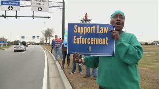 Federal workers protest government shutdown at airport