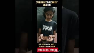 A student of Candlefire Development Academy performing multi-tasking... Applauds Christa....