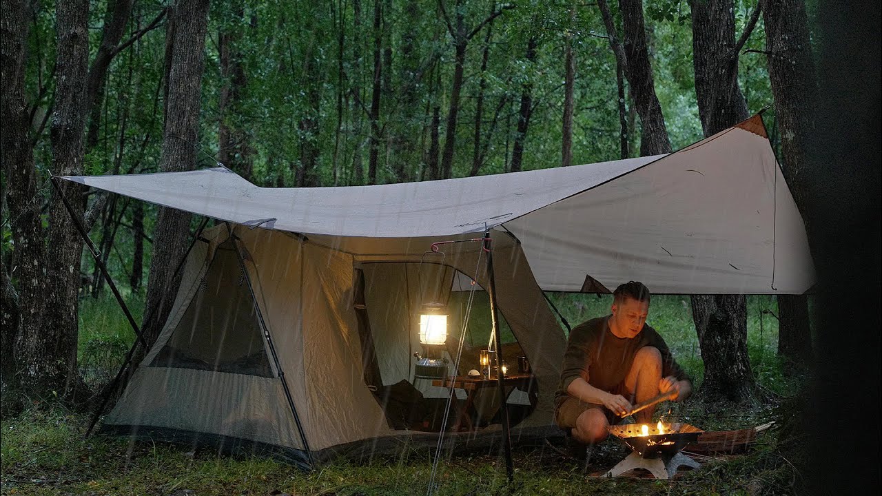 Solo CAMPING in RAIN  relaxing in the cosy tent shelter ASMR  photo