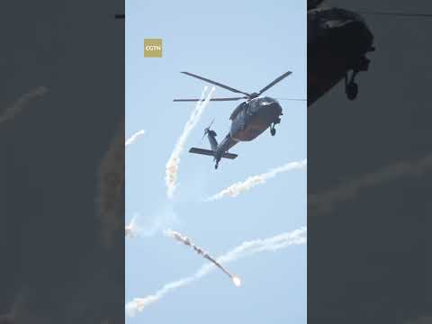 Stunning pla aerobatic team performances at tianjin helicopter expo