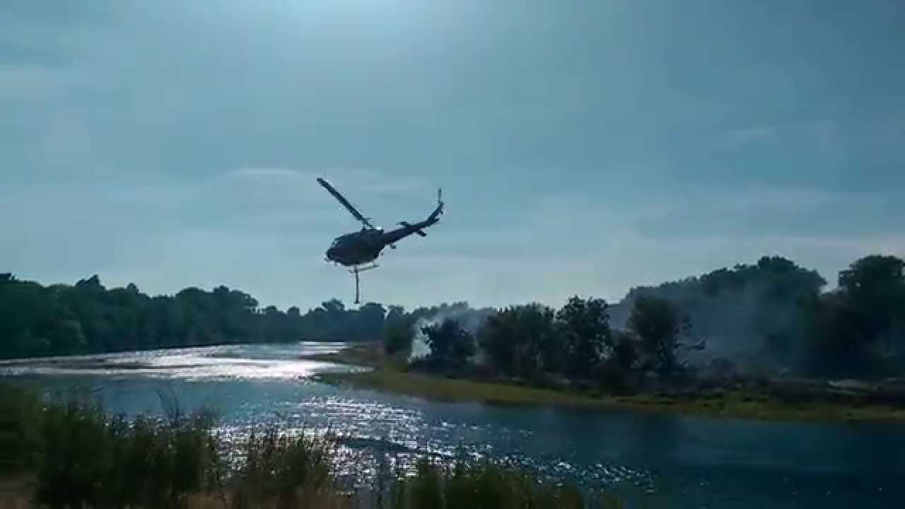 Helicopter water pickup from American River to fight Cal Expo Fire, July 4, 2014