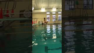 Girl does backflip into pool and bumps her head on diving board