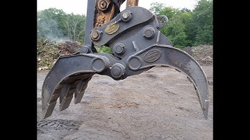heavy duty demolition grapple working on an excavator