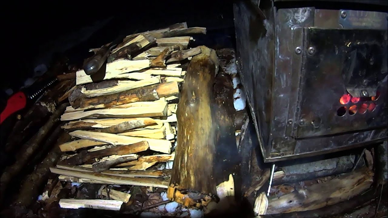 Kifaru 4-man tipi and small stove in the sleet and rain. - YouTube
