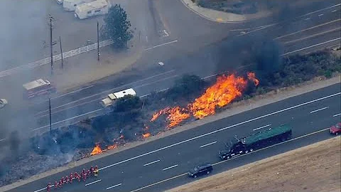 Millions in the West deal with dangers of wildfires and extreme heat