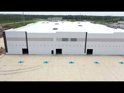 Amazon distribution center aerial news footage thumbnail