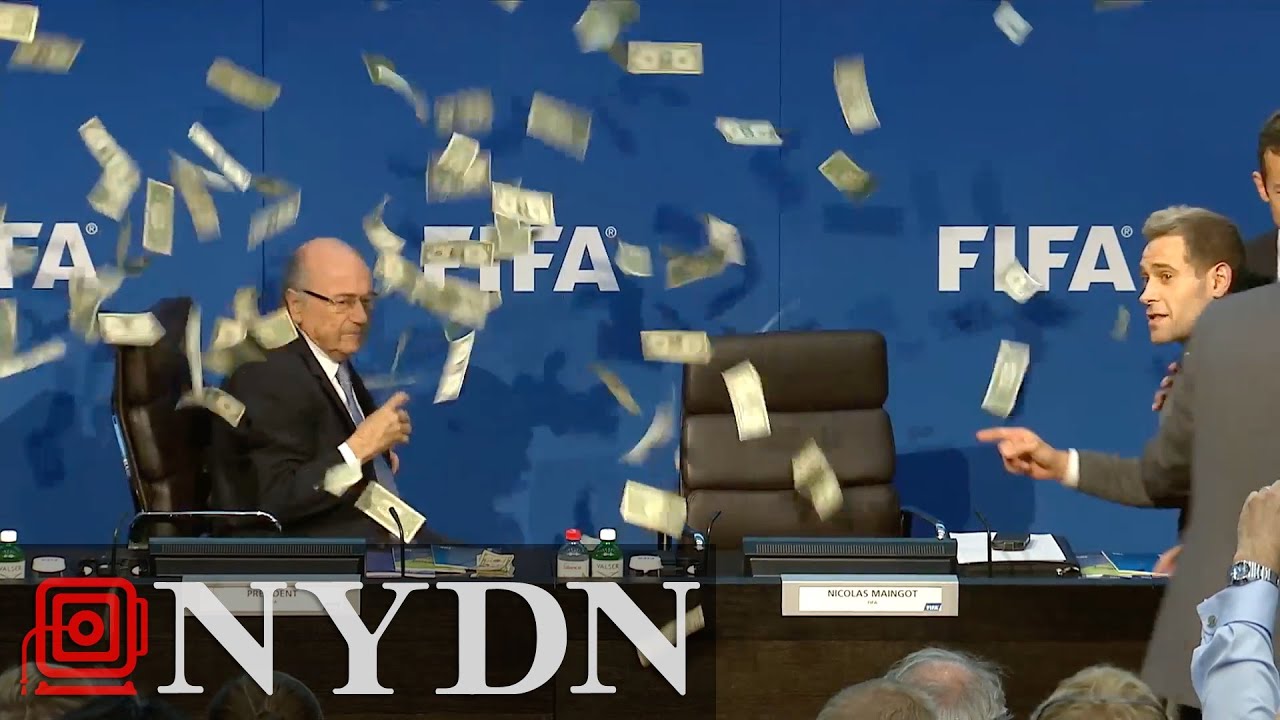 Comedian throws money at Sepp Blatter at FIFA Press Conference YouTube