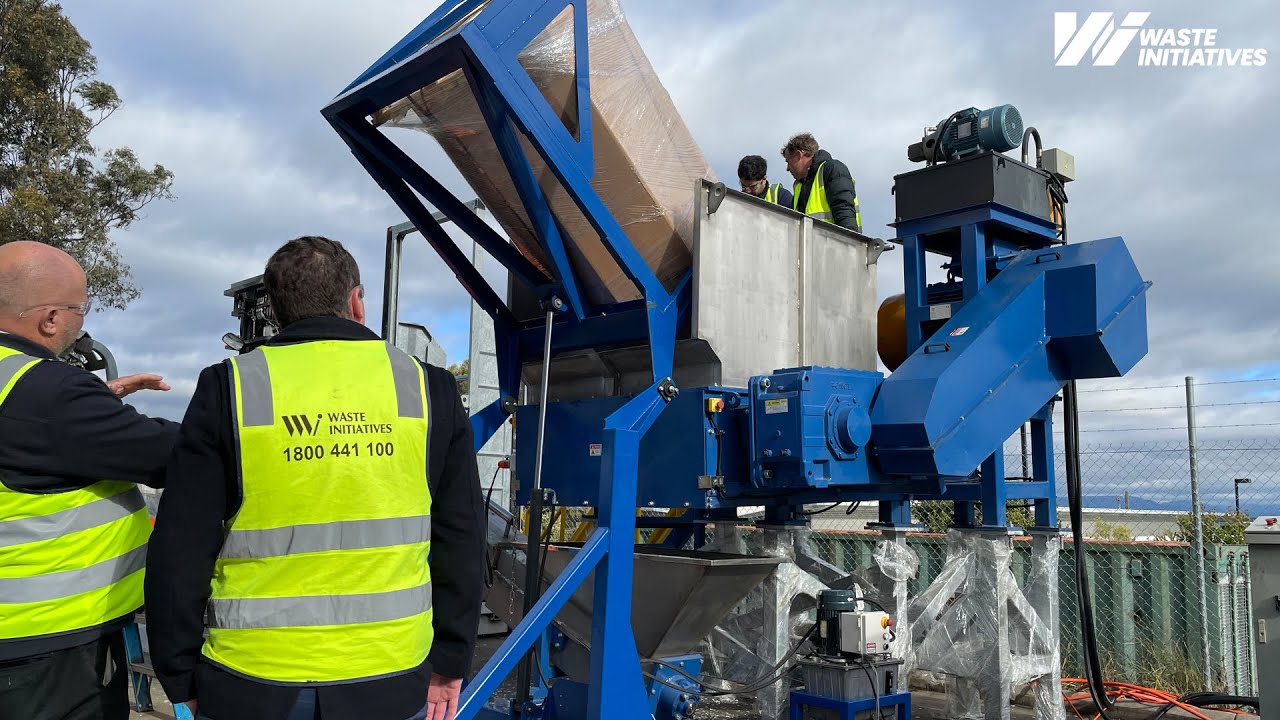Pharmaceutical trial on plastic medical containers with a Single Shaft Shredder and a Screw Loader.