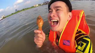Vừa bơi qua sông Sài Gòn vừa ăn hết 5 cái gà rán KFC siêu cay